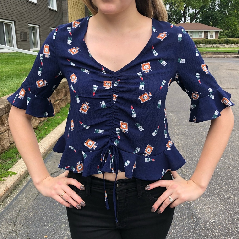 Elodie perfume and lipstick pattered crop top